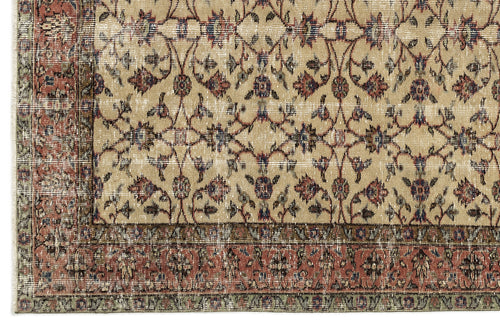 Load image 1 in gallery view. Beige rug with a distressed floral vine pattern in red, blue, and green, featuring a wide decorative border.