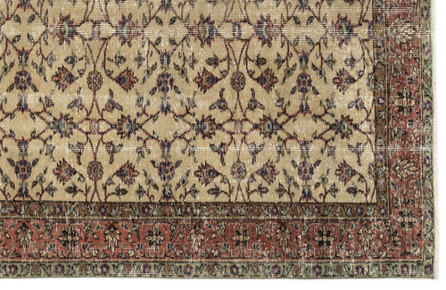 Load image 1 in gallery view. Beige rug with a distressed floral vine pattern in red, blue, and green, featuring a wide decorative border.