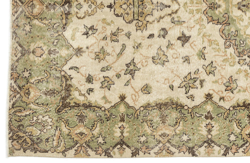 Load image 1 in gallery view. Distressed cream rug with sage green and brown traditional floral medallion pattern.
