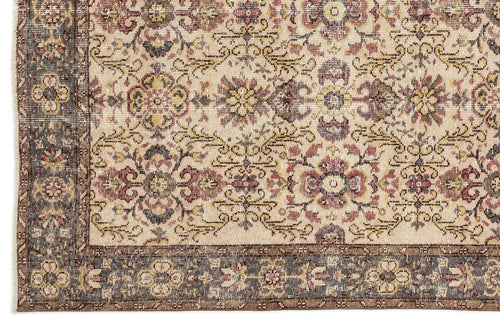 Load image 1 in gallery view. Beige traditional rug with a distressed floral medallion pattern and a dark brown border.