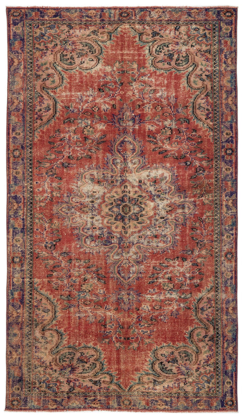 Load image 1 in gallery view. Distressed red, blue, and beige traditional rug with a central floral medallion and ornate border.