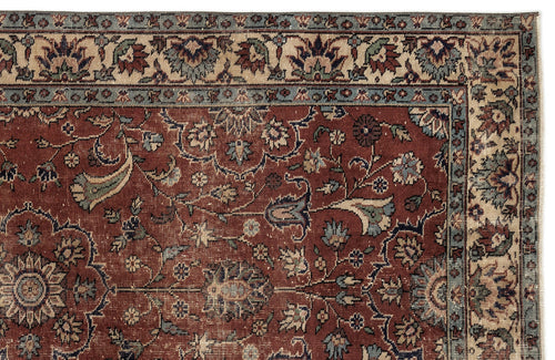 Load image 1 in gallery view. Traditional Persian-style rug with a deep red field, intricate floral vine patterns, and a multi-layered border.