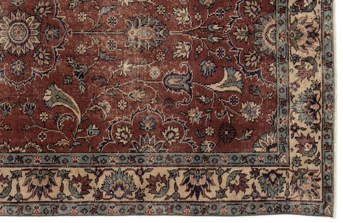 Load image 1 in gallery view. Traditional Persian-style rug with a deep red field, intricate floral vine patterns, and a beige and blue border.