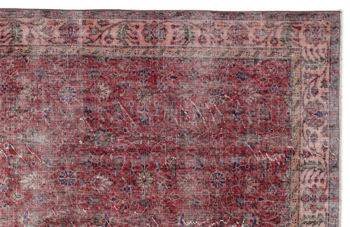 Load image 1 in gallery view. Distressed red and pink traditional rug with a floral medallion pattern and a detailed border.
