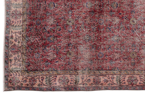 Load image 1 in gallery view. Distressed red and pink traditional rug with a faded floral medallion pattern and a decorative border.
