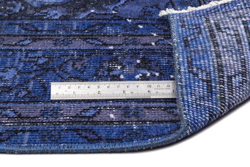 Load image 1 in gallery view. Blue and black distressed patterned rug with a white fringe, shown with a metal ruler for scale.