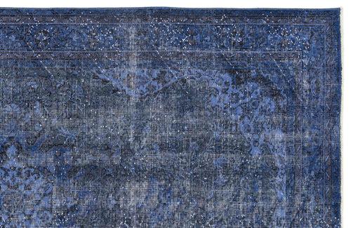 Load image 1 in gallery view. Deep blue distressed rug with a traditional floral medallion pattern and a bordered edge.