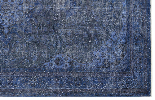 Load image 1 in gallery view. Deep blue distressed rug with a faded traditional floral medallion pattern and a bordered edge.