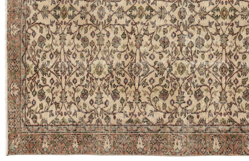 Load image 1 in gallery view. Beige rug with a traditional floral vine pattern in muted green, rust, and blue, featuring a decorative border.