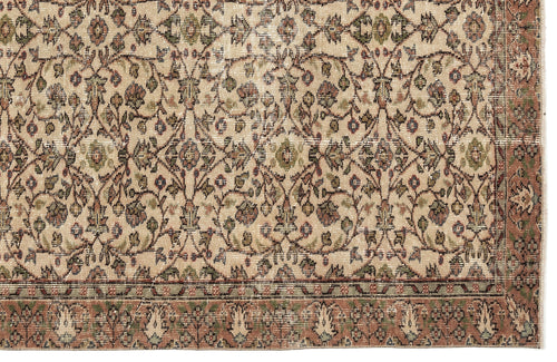 Load image 1 in gallery view. Beige traditional rug with a distressed floral vine pattern in muted green, red, and blue tones.