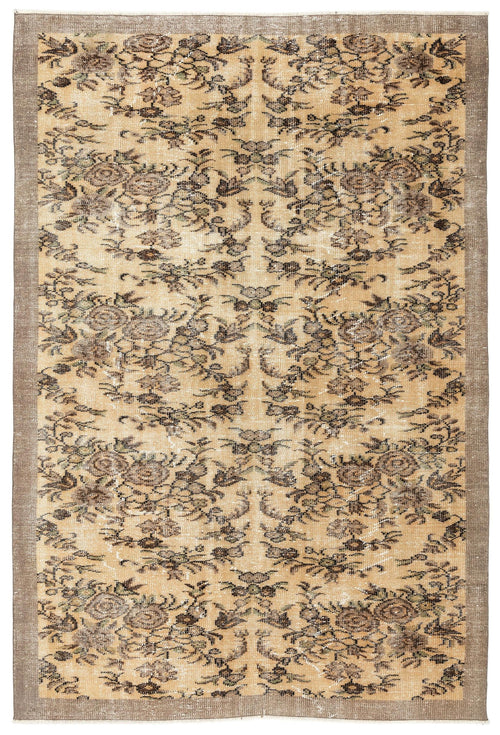 Load image 1 in gallery view. Tan and brown distressed rug with a repeating floral medallion pattern and a solid border on a white background.