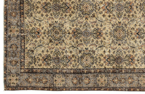 Load image 1 in gallery view. Beige and brown traditional rug with a distressed floral medallion pattern and a detailed geometric border.