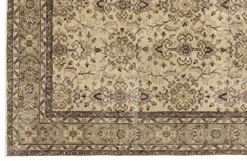 Load image 1 in gallery view. Beige and olive green traditional rug with a distressed floral medallion pattern and a dark brown geometric border.