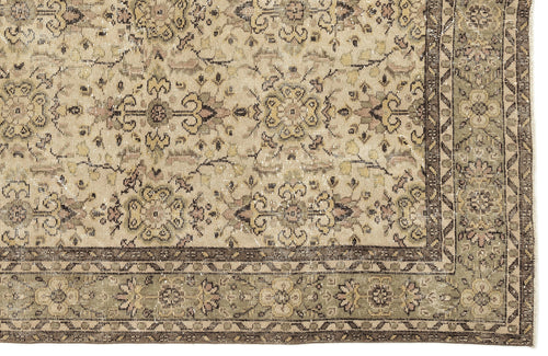Load image 1 in gallery view. Distressed beige rug with a faded floral medallion pattern and a dark brown geometric border.