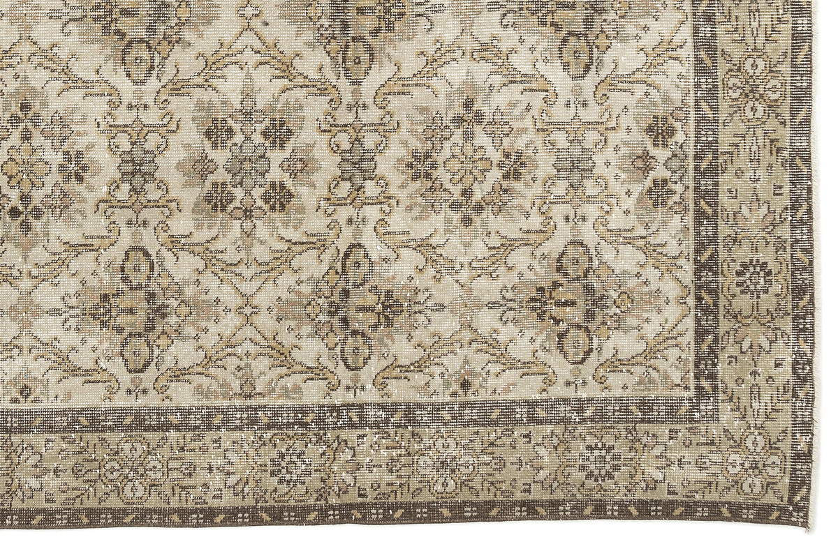 The Sadeane Vintage Floral Rug (6'0 X 9'8) features an ornate blend of beige, brown, and cream tones in intricate floral and geometric patterns, finished with a detailed dark border.