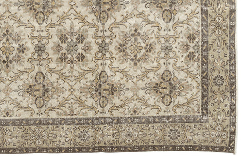 Load image 1 in gallery view. The Sadeane Vintage Floral Rug (6'0 X 9'8) features an ornate blend of beige, brown, and cream tones in intricate floral and geometric patterns, finished with a detailed dark border.
