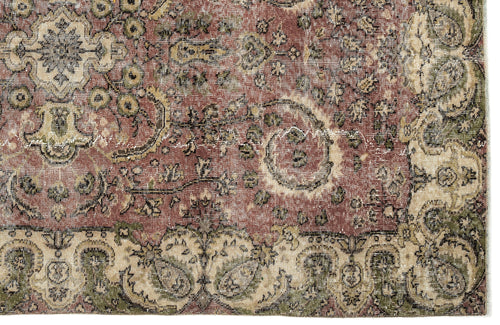 Load image 1 in gallery view. Distressed terracotta, sage green, and cream traditional rug with an intricate floral medallion and border pattern.