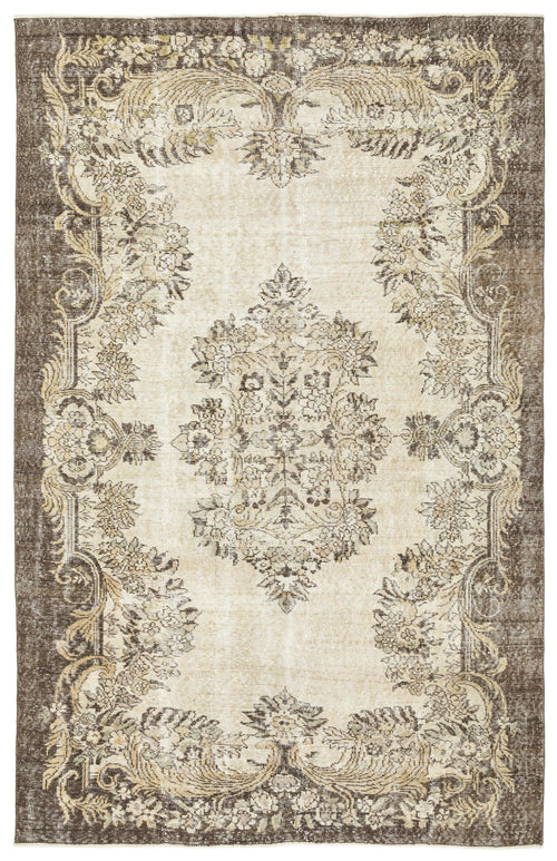 Load image 1 in gallery view. Distressed beige and brown rug with a central floral medallion and ornate botanical border.