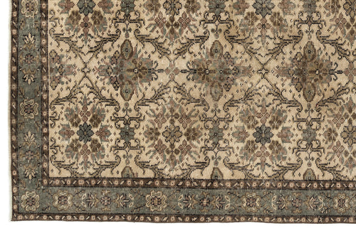 Load image 1 in gallery view. Beige, brown, and slate blue traditional rug with a distressed floral medallion pattern and a wide decorative border.