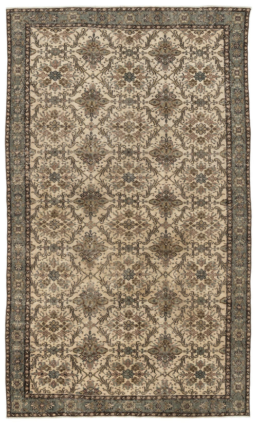 Load image 1 in gallery view. Beige and sage green traditional rug with a repeating floral medallion pattern and a distressed finish.