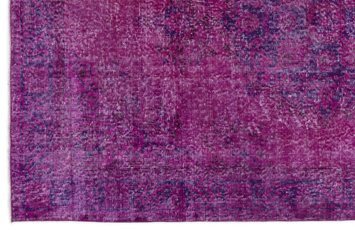 Load image 1 in gallery view. Magenta and deep purple distressed rug with a faded traditional medallion pattern.