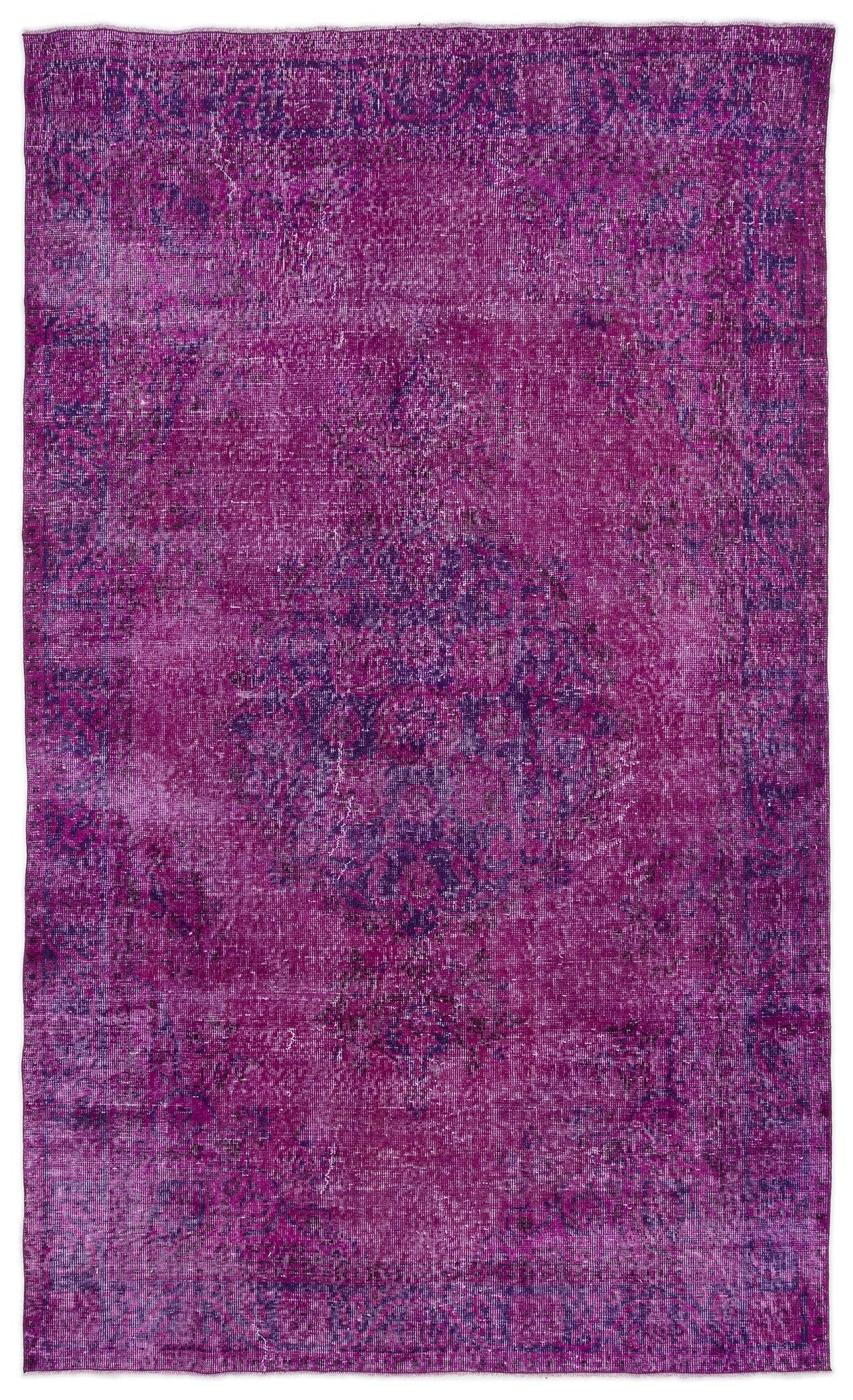 Magenta and purple distressed vintage-style rug with a central medallion and ornate border.