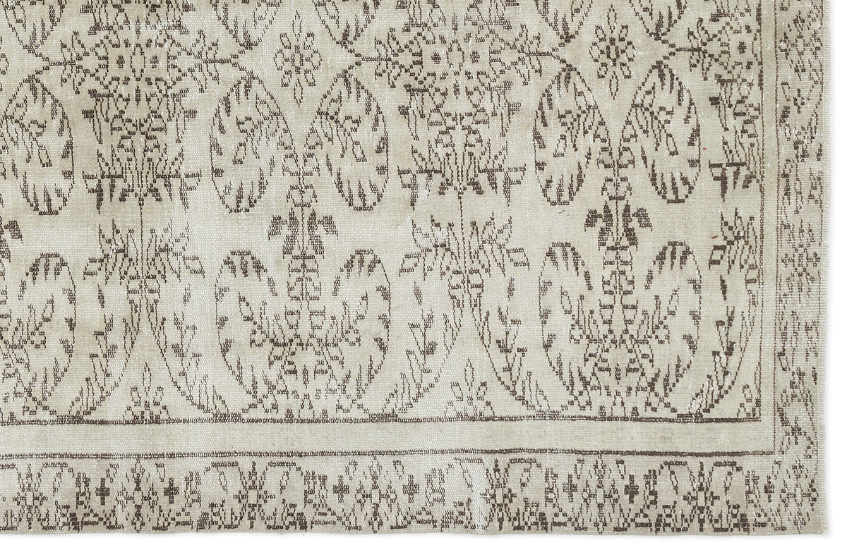 The Greunoa Vintage Floral Rug (5'4" x 9'6") features beige and brown distressed hues, ornate symmetrical floral and vine patterns along the border and center, creating a classic vintage look for your space.