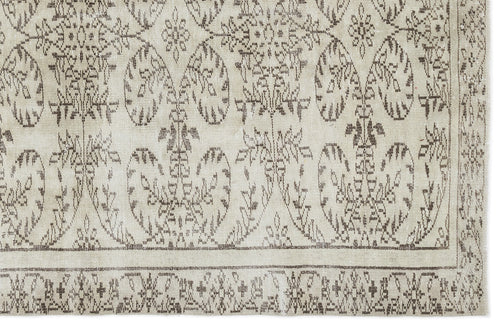 Load image 1 in gallery view. The Greunoa Vintage Floral Rug (5'4" x 9'6") features beige and brown distressed hues, ornate symmetrical floral and vine patterns along the border and center, creating a classic vintage look for your space.