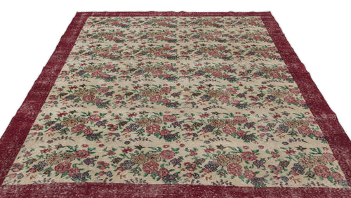 Load image 1 in gallery view. Beige rug with a distressed floral pattern in red, green, and purple, featuring a wide solid red border.