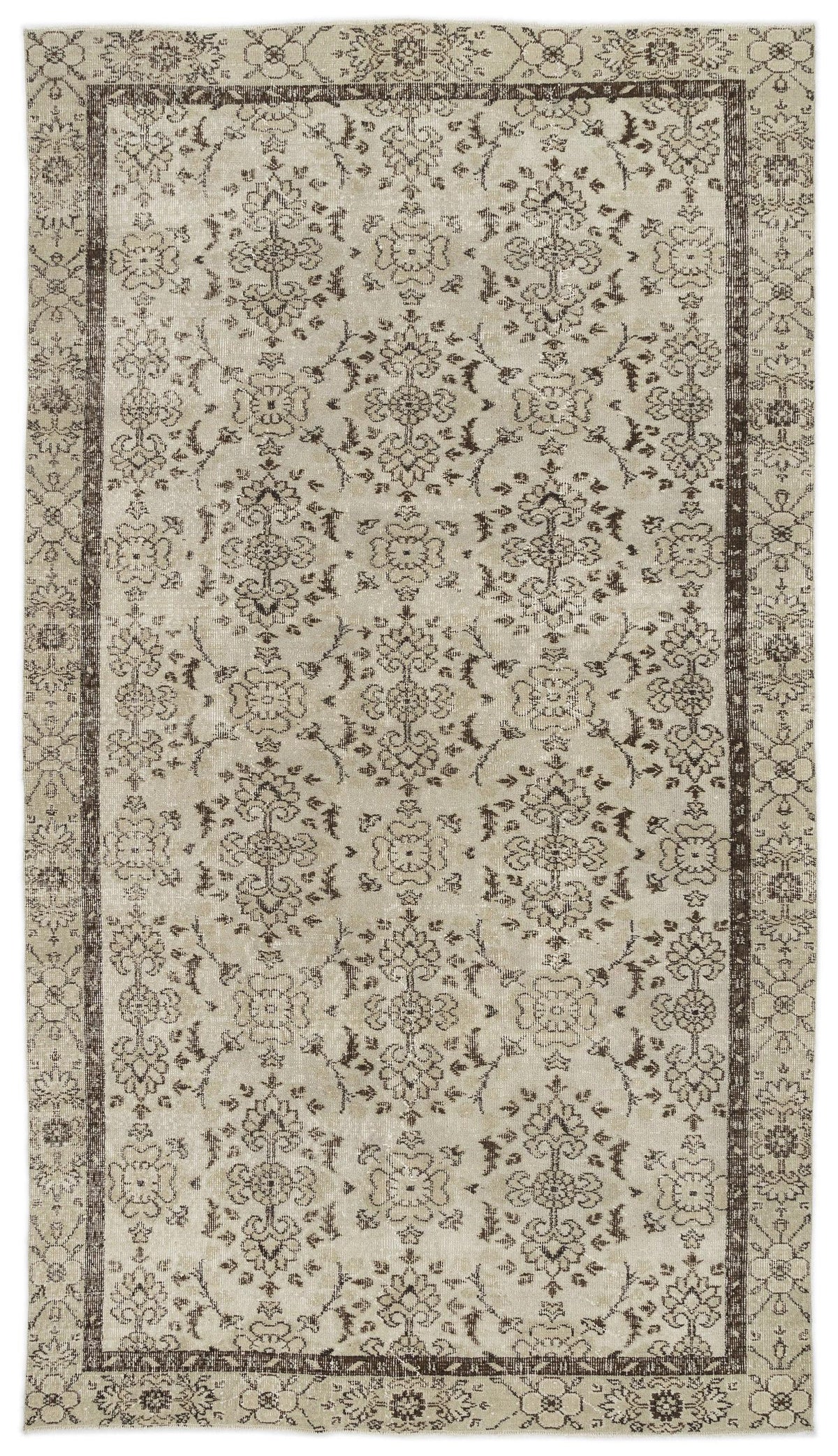 Beige and dark brown vintage-style rug with a repeating floral medallion pattern and a decorative border.