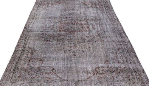 Load image 1 in gallery view. Distressed grey and faded red vintage-style rug with a central medallion and ornate border on a white background.