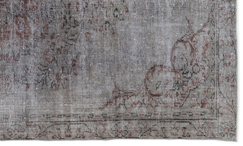 Load image 1 in gallery view. Distressed grey and faded red rug with a traditional floral medallion pattern and a bordered edge.