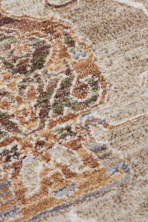 Load image 1 in gallery view. Close-up of a traditional rug with a beige field and a detailed medallion pattern in rust, olive green, and slate blue.
