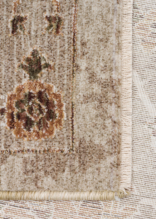 Load image 1 in gallery view. Beige and cream traditional rug with a distressed floral medallion pattern and fringed edge.