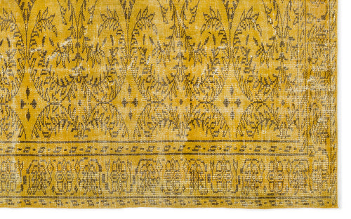 Load image 1 in gallery view. Mustard yellow and charcoal distressed rug with an ornate botanical medallion pattern and a geometric border.