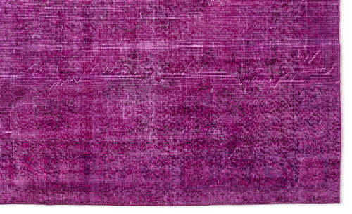 Load image 1 in gallery view. Magenta rug with a distressed, overdyed vintage pattern and visible woven texture.