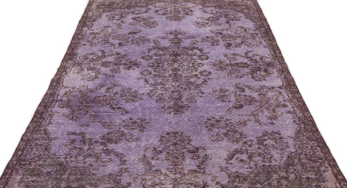 Load image 1 in gallery view. Distressed lavender and dark brown rug with a traditional floral medallion pattern on a white background.