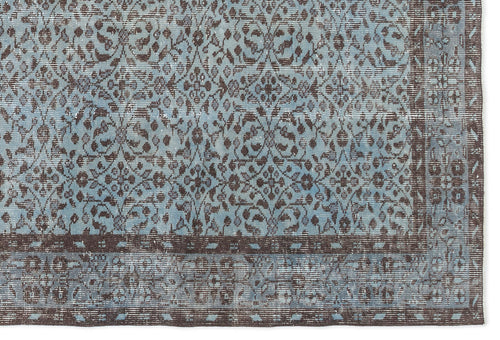 Load image 1 in gallery view. Light blue and dark brown rug with a distressed floral damask pattern and a wide geometric border.