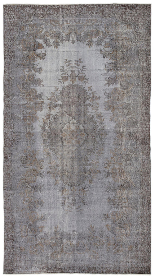 Load image 1 in gallery view. Grey and brown distressed vintage-style rug with a faded central floral medallion and ornate border.