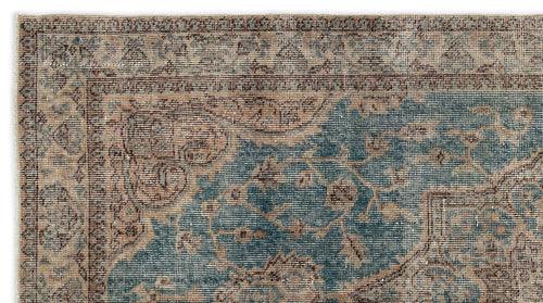 Load image 1 in gallery view. Distressed blue and beige traditional rug with an intricate floral medallion pattern and a detailed border.