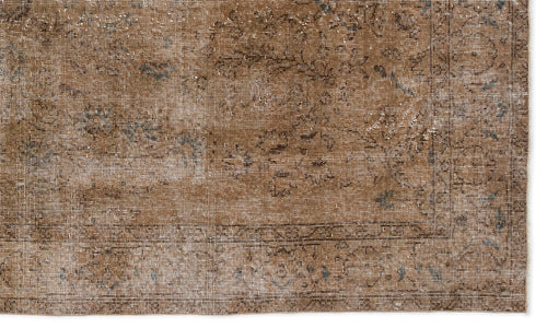 Load image 1 in gallery view. Brown distressed rug with a faded traditional floral medallion pattern and a bordered edge.