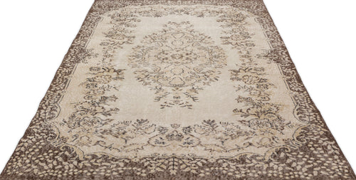 Load image 1 in gallery view. The Petida - Vintage Medallion Rug (5'8 x 9'5) features an ornate floral pattern in beige and brown with a detailed central medallion and decorative borders, bringing vintage charm to any space.