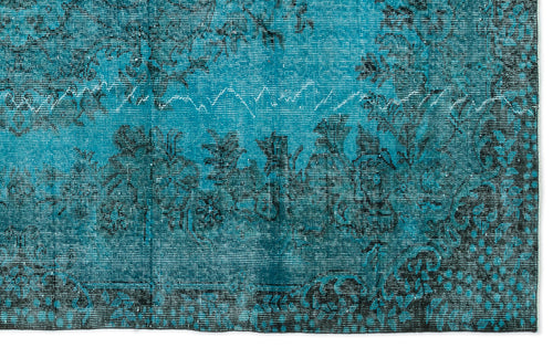 Load image 1 in gallery view. Teal and black distressed rug with a traditional floral medallion pattern on a white background.