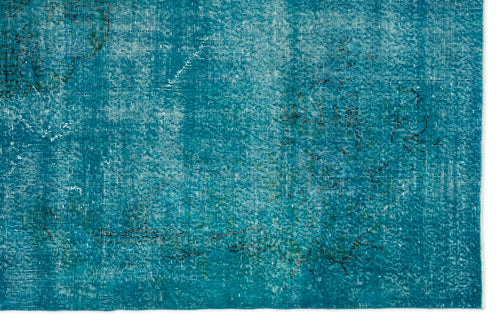 Load image 1 in gallery view. Teal distressed rug with a faded, overdyed traditional floral pattern and white worn accents.