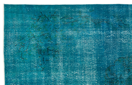 Load image 1 in gallery view. Teal distressed rug with a faded, overdyed finish and faint black linear floral motifs.