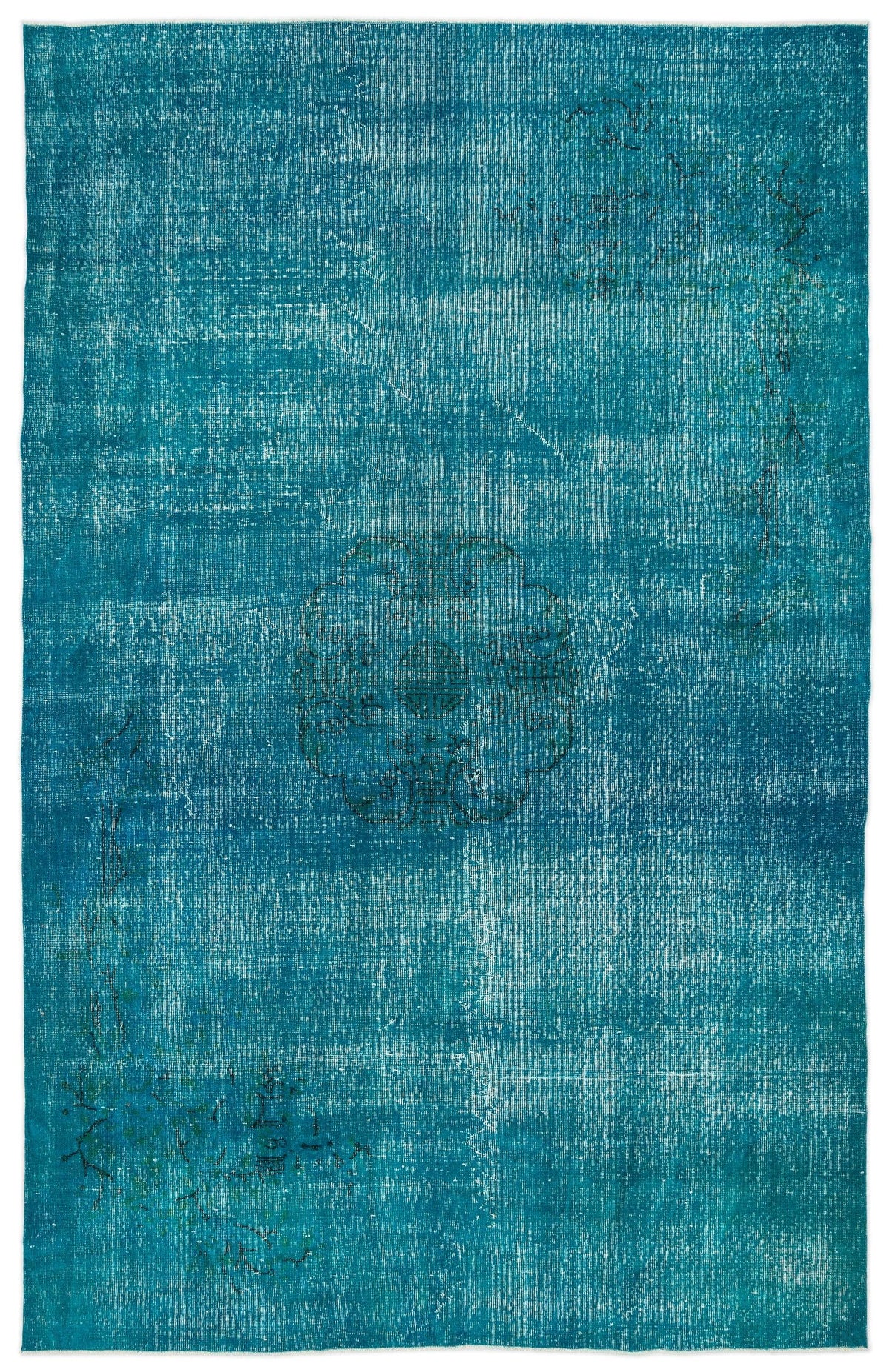 Teal distressed overdyed rug with a central medallion and faint floral motifs.