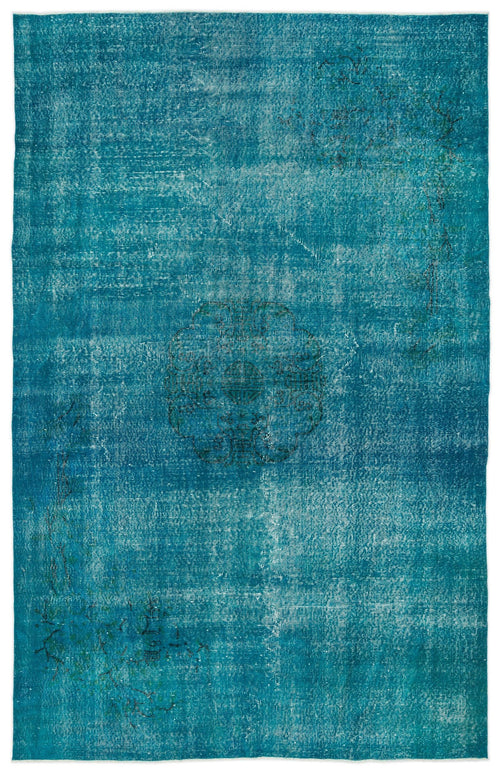 Load image 1 in gallery view. Teal distressed overdyed rug with a central medallion and faint floral motifs.
