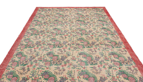 Load image 1 in gallery view. Beige vintage-style rug with a red border and a repeating floral pattern in green, pink, and blue.