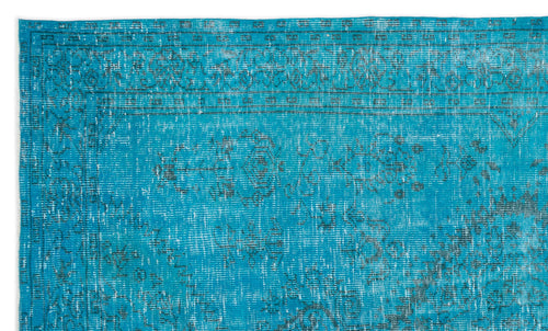 Load image 1 in gallery view. Bright turquoise rug with a distressed, faded traditional medallion pattern and a dark geometric border.