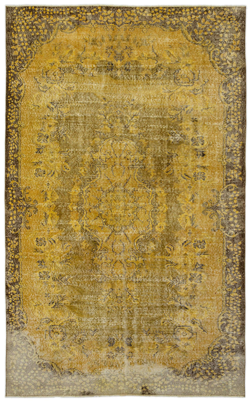 Load image 1 in gallery view. Mustard yellow and dark brown distressed traditional rug with a central floral medallion and ornate border.